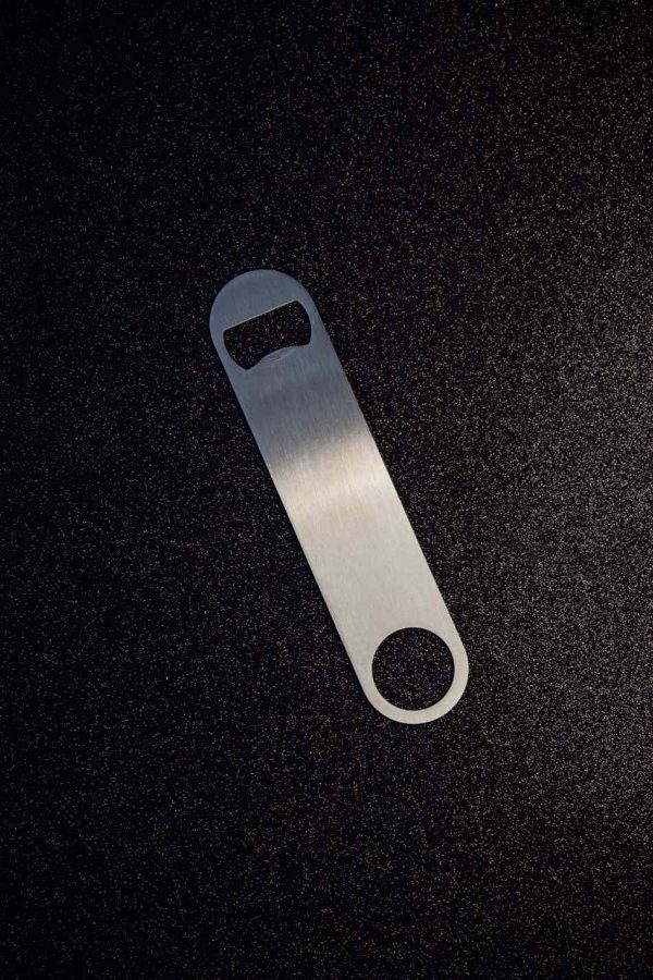 Sleek and sturdy flat brown bottle opener for effortless popping of beverages, perfect for any occasion. Get yours today!