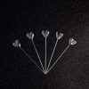 Shiny silver heart cocktail sticks for elegant parties and fancy gatherings, set of 12 exquisite pieces for your exquisite occasions.