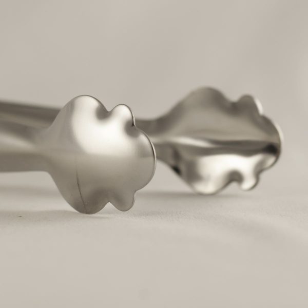 Add elegance to your drinks with Clover Stainless Ice Toppers featuring spring design - perfect addition for any gathering!